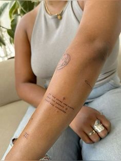 a woman with a tattoo on her arm