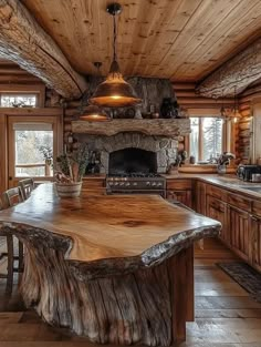 a kitchen with an island made out of logs