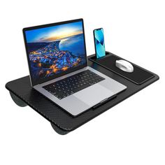 Designed for the home office, this lap desk provides a comfortable workspace anywhere and can be used as a laptop desk, regular desk or even a nightstand. It comes with a cushioned wrist rest and a precision-tracking mouse pad, making typing more convenient and easier. With a convenient phone slot, you can enjoy hands-free video watching or FaceTiming with friends while focusing on your laptop tasks. The lap desk's dual-bolster cushions effectively dissipate heat, keeping your lap cool. Lightwe… Comfortable Workspace, Laptop Tray, Tv Trays, Lap Desk, Inbox Zero, Bolster Cushions, Media Storage, Wrist Rest, Laptop Desk