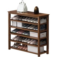 the shoe rack has many pairs of shoes on it and is next to a purse