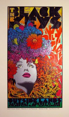 a poster with an image of a woman's face and flowers in her hair