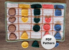 a crochet pattern for a potholder with different colors and shapes on it