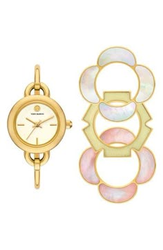 Stacked double-T logos punctuate a slender bangle watch that can be taken up a notch with three interchangeable, flower-shaped top rings in an array of shapes and colors. 27mm case; 5mm band width Includes watch and three interchangeable top rings Quartz movement Mineral crystal face Stainless steel with goldtone plate/mother-of-pearl/epoxy Imported Zodiac Watches, Womens Designer Watches, Watch Set, Bangle Watches, Watch Gift, Top Rings, Stainless Steel Bangles, Sneaker Dress Shoes, Bracelet Ideas