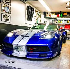 a blue sports car parked in a garage