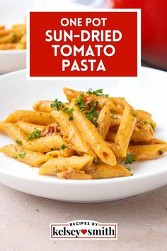 one pot sun - dried tomato pasta with parsley on the side in a white bowl