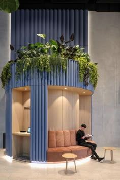 a man stands at the bar of the world port center rotterdam surrounded by green plants Space Within Space Interior, Pod Interior Design, Biophilic Workplace Design, Apartment Complex Interior Lobby, Modern Commercial Interior Design, Breakout Room Design, Cool Waiting Rooms, Interior Design Commercial Spaces, Playful Office Design