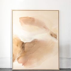 an abstract painting hangs on the wall