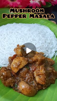 a green plate topped with meat and rice on top of a leafy tablecloth