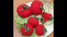 crocheted strawberries on lettuce with leaves