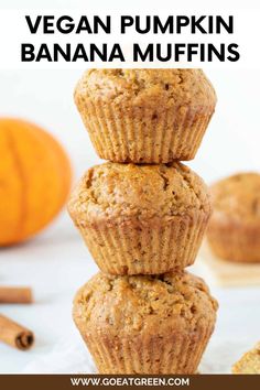 vegan pumpkin banana muffins stacked on top of each other with cinnamon sticks in the background