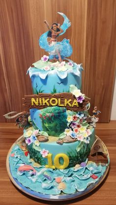 a birthday cake with the name nikoleka on it and an image of a mermaid