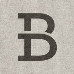 the letter b is made up of black and white letters on a light gray background