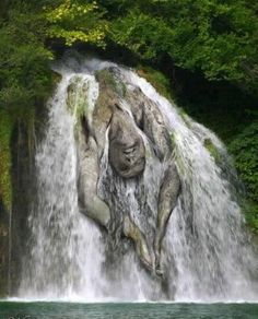 there is a large waterfall in the woods