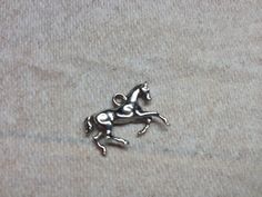 Etsy $4.99- This silvertone horse charm looks a lot like mine. Horse Pendant, Horses Pendant, Silver Tone, Silver Rings, Horses