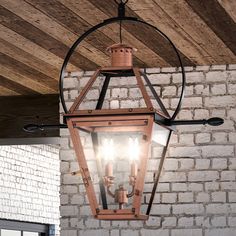 an old fashioned lantern hanging from the ceiling