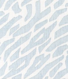 a blue and white wallpaper with an animal print pattern on the back of it