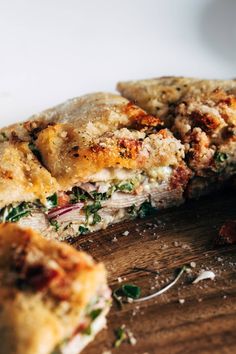 a half eaten pizza sitting on top of a wooden cutting board