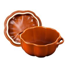 two brown dishes sitting next to each other