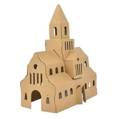 three cardboard buildings made to look like churches