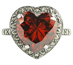 This sparkly simulated red diamond ring is sure to steal your heart the moment you slip it on your finger. From Suspicion® Marcasite Jewelry. Heart-shaped Red Sterling Silver Rings, Red Heart-shaped Rings With Center Stone, Red Sterling Silver Heart-shaped Rings, Heart-shaped Sterling Silver Ruby Ring, Red Diamond Ring, Heart-shaped Red Ruby Ring In Sterling Silver, Marcasite Jewelry, Red Diamond, Prong Setting