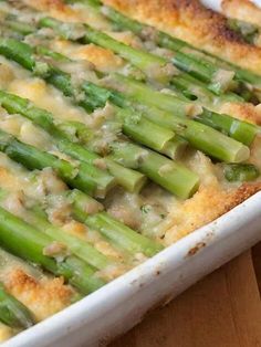 a casserole dish with asparagus and cheese