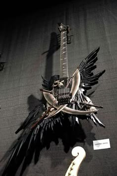 an electric guitar with wings attached to it