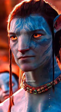 an avatar with blue skin and orange eyes