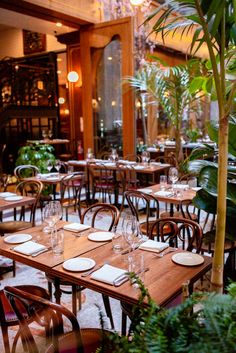 an empty restaurant with tables and chairs set up for formal dinner or luncheons