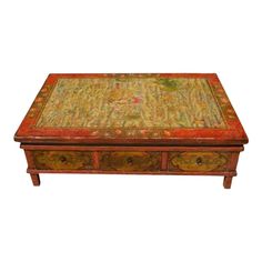 This is the most awesome coffee table! Gorgeous colors. It is wood & solid / sturdy. Heavy even with the drawers removed. The top has all different animals, hand painted possibly with dragons & such. This appears to be canvas, looking at the edges, which does have some wear. 6 drawers all with metal pull rings. I have no idea on the age or origin. Approx 47" x 32" x 15" high.