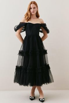 Imbued With Artisanal Allure And Dark Romance, This Captivating Tulle Dress Promises To Make An Entrance At Your Next Event. A Draped Corset Bodice Cinches The Waist, Adding A Sultry Element, While The Tiered Tulle Skirt Flares Out To Create A Dramatic Silhouette Which Exudes High-End Glamour.Tiered Tulle Skirtcorset Bodicedraped Mesh Sleeves Cocktail Dress With Corset Back And Tulle Material, Evening Dresses With Ruched Bodice In Tulle, Tulle Dresses With Ruched Bodice For Evening, Black Tulle Corset Dress With Sheer Bodice, Fitted Tulle Corset Dress For Prom, Cocktail Corset Dress With Sheer Bodice And Tulle, Fitted Tulle Corset Cocktail Dress, Ruched Tulle Dress With Fitted Bodice, Black Strapless Tulle Corset Dress