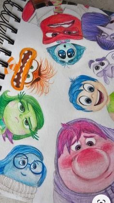 an image of children's faces drawn in colored pencils on a white paper