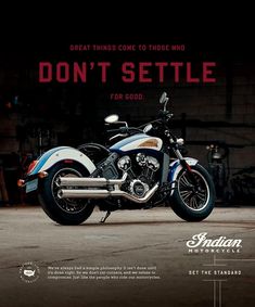 a motorcycle parked in front of a garage with the words don't setile on it