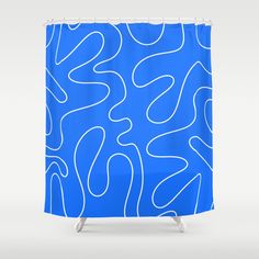 a blue shower curtain with white lines on it