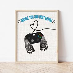 Father's Day Footprint Art | Gamer Dad Gifts | Ollie + Hank Gamer Fathers Day Gifts From Kids, Diy Gifts For Dad From Baby, Father’s Day Footprint, Dads First Birthday Gift From Baby, Christmas Craft For Dad, Father’s Day Canvas Crafts, Father’s Day Canvas, Baby Craft Gifts, Gamer Dad Gifts Father's Day