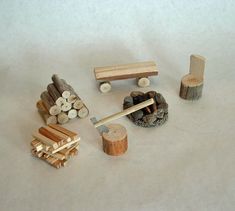 a group of wooden toys sitting on top of a white surface