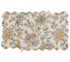 four placemats with floral designs on them