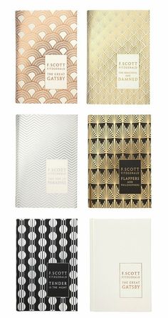 four different types of notebooks with black and white designs on the front, one in gold