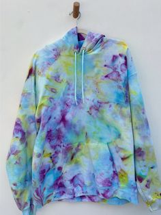 One of a kind ice dyed hooded sweatshirts with drawstring hood. Fit is more relaxed and sizing is more unisex. 60% cotton, 40% poly Machine wash cold with like colors. Individually ice dyed with non-toxic dyes. What is Ice Dyeing? It’s a form of dying clothes were the fabric is first covered in ice, then the dye is applied on top. As the ice melts it creates a OOAK watercolor effect. XS S M L XL 2XL 3XL 4XL 5XL Body Length 26 27 28 29 30 31 32 33 34 Body Width 18 20 22 24 26 28 30 32 34 Sleeve L Ice Melting, Ice Dyeing, The Ice, British Indian, Knit Beanie, Hoodie Sweatshirt, Short Sets, Jacket Dress, Hooded Sweatshirts