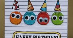 a birthday card with three different colored eyes and hats on it's front, along with the words happy birthday