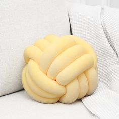 a pillow made out of bananas sitting on a couch