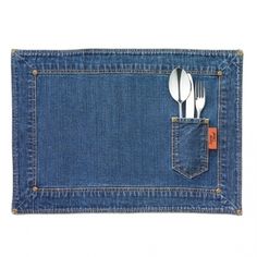 a fork and spoon in the pocket of a denim napkin