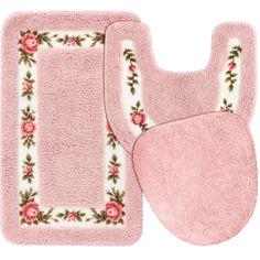 two pink rugs, one with roses on it and the other with white trim