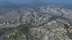 an aerial view of a city with lots of tall buildings