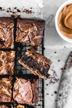 chocolate brownies with peanut butter frosting on a cooling rack