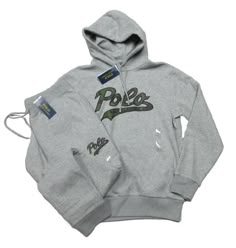 PLEASE NOTE: DUE TO HIGH VOLUME AND POST OFFICE DELAYS, DELIVERY TIMES MAY BE LONGER THAN NORMAL. ALL SALES ARE FINAL. NO RETURNS ACCEPTED. POLO RALPH LAUREN GREY HEATHER LOGO SCRIPT GRAPHIC HOODIE & JOGGER PANT SET HOODIE: ATTACHED DRAWSTRING HOOD LONG SLEEVES PULLOVER STYLE RIBBED TRIM EMBROIDERED LOGO CAMO SCRIPT GRAPHIC AT CHEST FLEECE LINED TWO SIDE POCKETS AT WAIST 70% COTTON 30% POLYESTER MACHINE WASHABLE IMPORTED JOGGER PANTS: DRAWSTRING ELASTICIZED WAIST EMBROIDERED CAMO LOGO GRAPHIC AT LEFT LEG TWO SIDE ON-SEAM POCKETS RIGHT BACK PATCH POCKET RIBBED HEM 70% COTTON 30% POLYESTER MACHINE WASHABLE IMPORTED ALL ITEMS ARE 100% AUTHENTIC AT YOURPLACE2SHOP International Buyers – Please Note:  Import duties, taxes, and charges are not included in the item price or shipping cost. These ch Polo Ralph Lauren Outfits, Cute Online Clothing Stores, Lauren Grey, Polo Outfit, Track Suits, Logo Script, Jogging Suit, Ralph Lauren Outfits, Pant Set