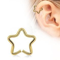 a pair of star shaped ear piercings