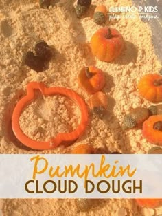 pumpkin cloud dough with an orange ring in the middle