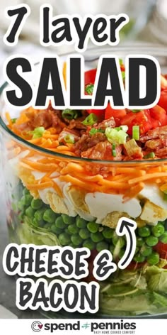 7 layer salad with cheese and bacon in a glass bowl