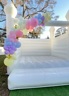 an inflatable bed with balloons attached to it