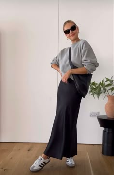 Spring Minimalist Outfit Minimal Classic, Elegant Trendy Outfit, Slip Skirt And Sneakers, Skirt And Trainers Outfits, Black Maxi Satin Skirt Outfit, Maxi Skirt Sneakers Outfit, Sneaker Skirt Outfit, Samba Skirt Outfit, Mermaid Skirt Outfit Casual